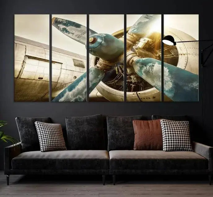 The Vintage Airplane Canvas Print, featuring a triptych design with an airplane propeller on museum-quality canvases with UV-protective coating, is displayed in a cozy living room.