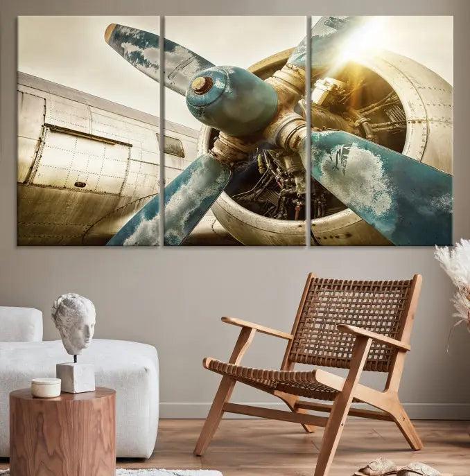 The Vintage Airplane Canvas Print, featuring a triptych design with an airplane propeller on museum-quality canvases with UV-protective coating, is displayed in a cozy living room.