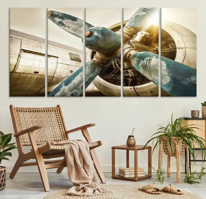 The Vintage Airplane Canvas Print, featuring a triptych design with an airplane propeller on museum-quality canvases with UV-protective coating, is displayed in a cozy living room.