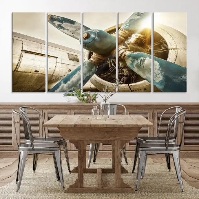 The Vintage Airplane Canvas Print, featuring a triptych design with an airplane propeller on museum-quality canvases with UV-protective coating, is displayed in a cozy living room.