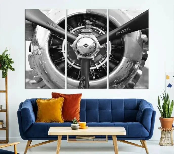 The Vintage Airplane Wall Art Canvas Print features a black and white image of an aircraft engine propeller elegantly divided into three panels.