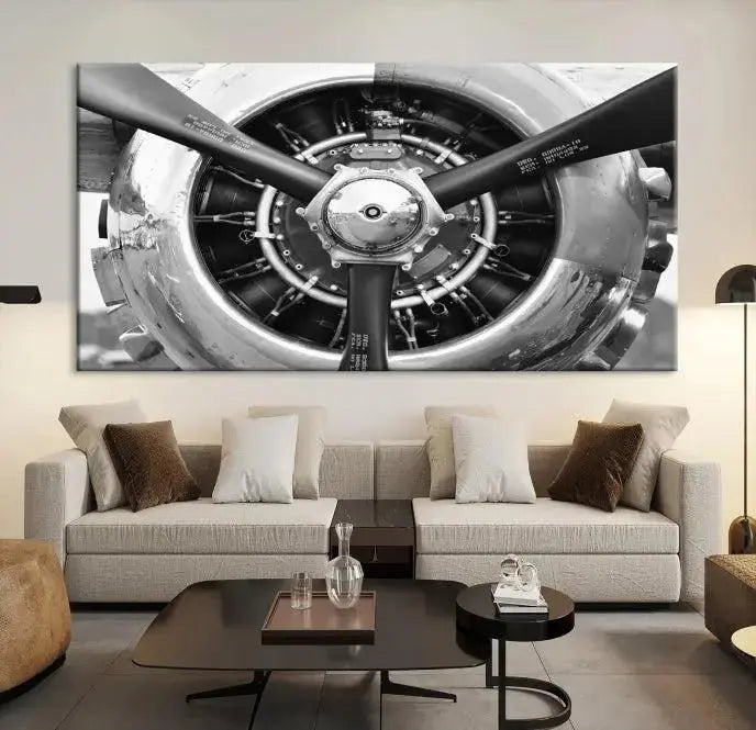 The Vintage Airplane Wall Art Canvas Print features a black and white image of an aircraft engine propeller elegantly divided into three panels.