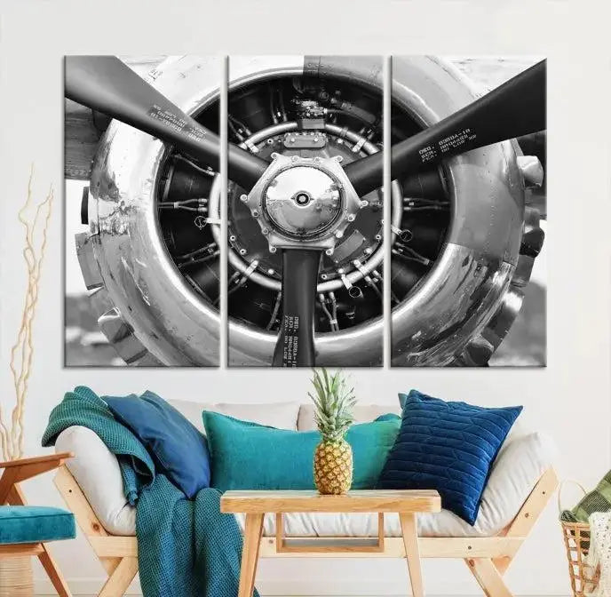 The Vintage Airplane Wall Art Canvas Print features a black and white image of an aircraft engine propeller elegantly divided into three panels.