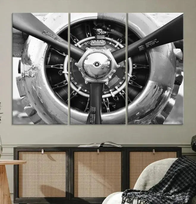 The Vintage Airplane Wall Art Canvas Print features a black and white image of an aircraft engine propeller elegantly divided into three panels.