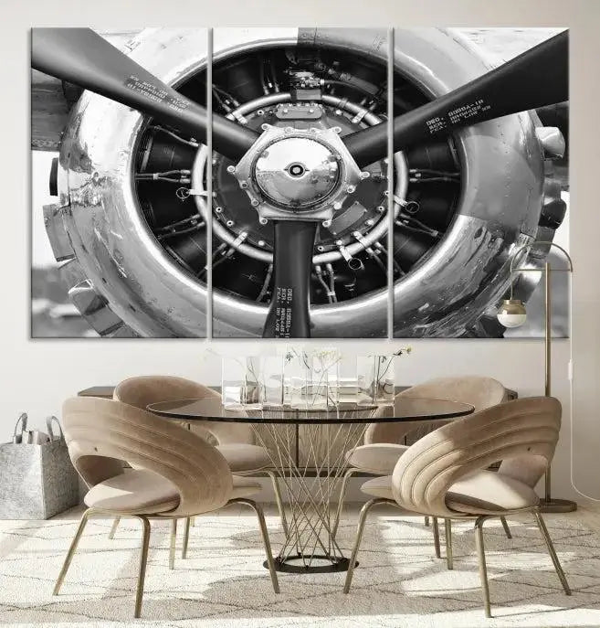 The Vintage Airplane Wall Art Canvas Print features a black and white image of an aircraft engine propeller elegantly divided into three panels.