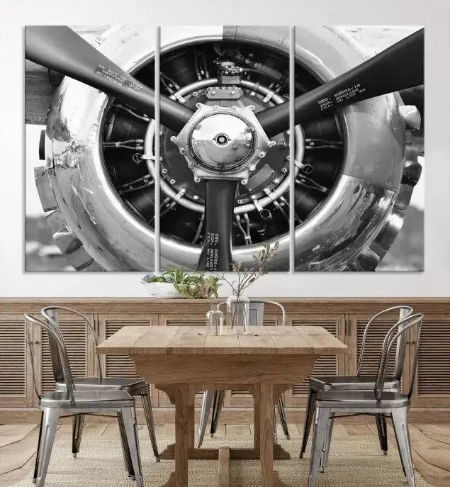 The Vintage Airplane Wall Art Canvas Print features a black and white image of an aircraft engine propeller elegantly divided into three panels.