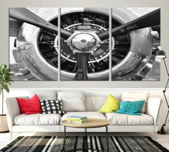 The Vintage Airplane Wall Art Canvas Print features a black and white image of an aircraft engine propeller elegantly divided into three panels.