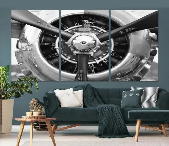 The Vintage Airplane Wall Art Canvas Print features a black and white image of an aircraft engine propeller elegantly divided into three panels.