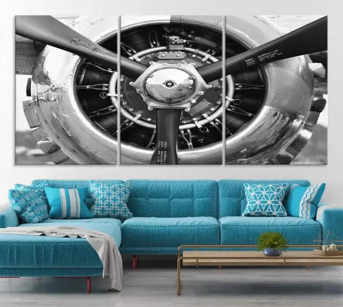 The Vintage Airplane Wall Art Canvas Print features a black and white image of an aircraft engine propeller elegantly divided into three panels.