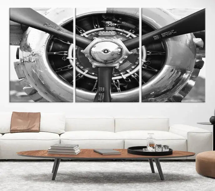 The Vintage Airplane Wall Art Canvas Print features a black and white image of an aircraft engine propeller elegantly divided into three panels.