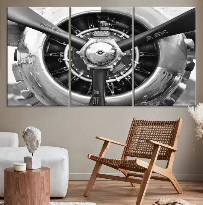 The Vintage Airplane Wall Art Canvas Print features a black and white image of an aircraft engine propeller elegantly divided into three panels.