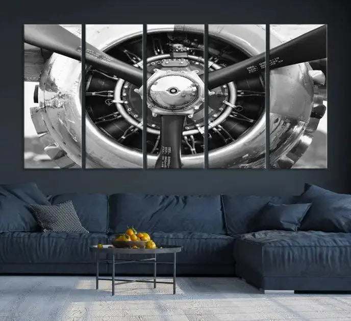 The Vintage Airplane Wall Art Canvas Print features a black and white image of an aircraft engine propeller elegantly divided into three panels.