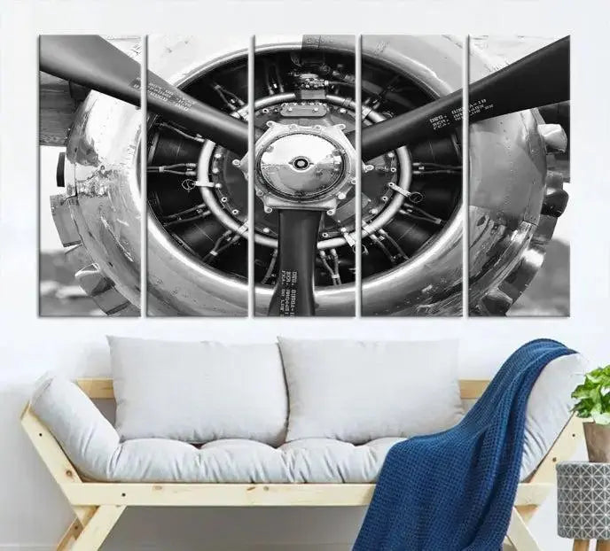 The Vintage Airplane Wall Art Canvas Print features a black and white image of an aircraft engine propeller elegantly divided into three panels.