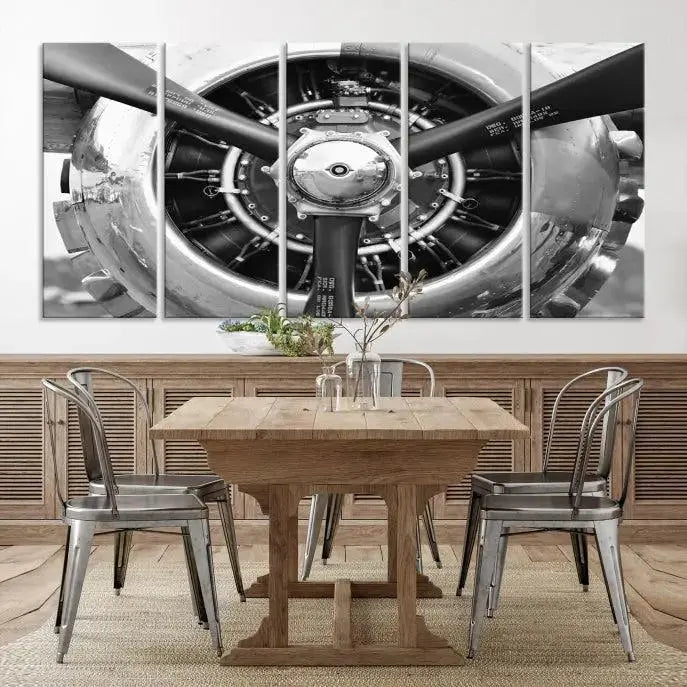 The Vintage Airplane Wall Art Canvas Print features a black and white image of an aircraft engine propeller elegantly divided into three panels.