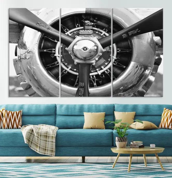 The Vintage Airplane Wall Art Canvas Print features a black and white image of an aircraft engine propeller elegantly divided into three panels.