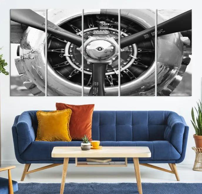 The Vintage Airplane Wall Art Canvas Print features a black and white image of an aircraft engine propeller elegantly divided into three panels.