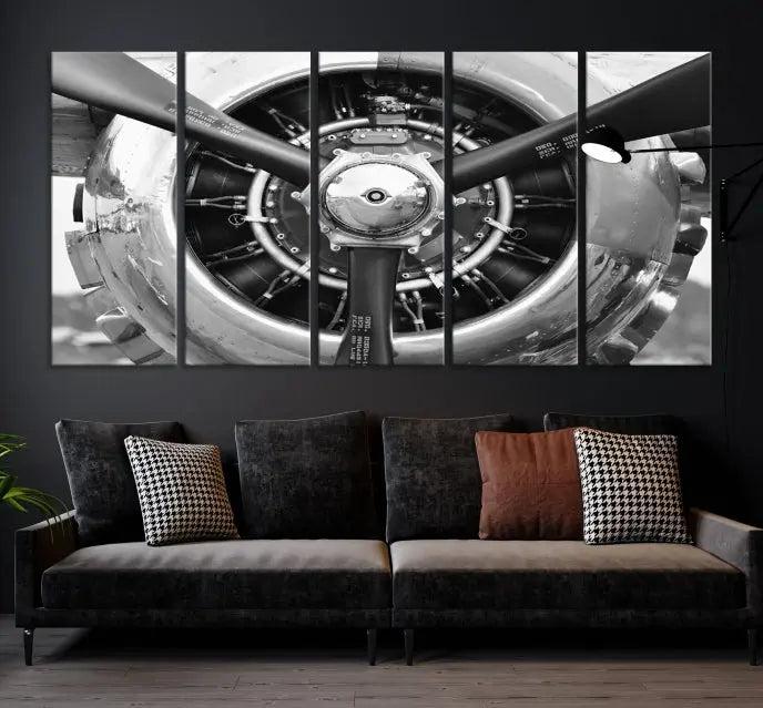 The Vintage Airplane Wall Art Canvas Print features a black and white image of an aircraft engine propeller elegantly divided into three panels.