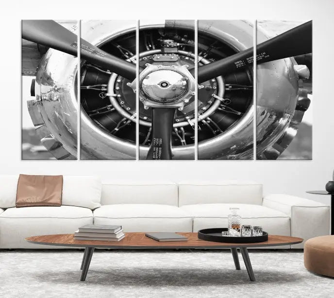 The Vintage Airplane Wall Art Canvas Print features a black and white image of an aircraft engine propeller elegantly divided into three panels.