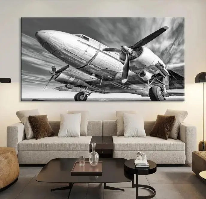 The Vintage Airplane on a Runway Canvas Print is elegantly showcased as a black and white triptych. Each panel is crafted on museum-quality canvases with a UV-protective coating for lasting beauty and durability. This timeless artwork comes with the convenience of free shipping.