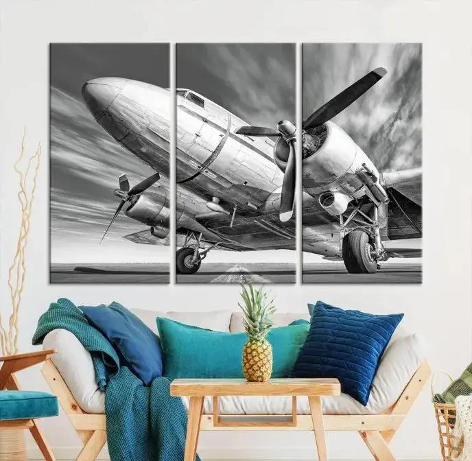 The Vintage Airplane on a Runway Canvas Print is elegantly showcased as a black and white triptych. Each panel is crafted on museum-quality canvases with a UV-protective coating for lasting beauty and durability. This timeless artwork comes with the convenience of free shipping.