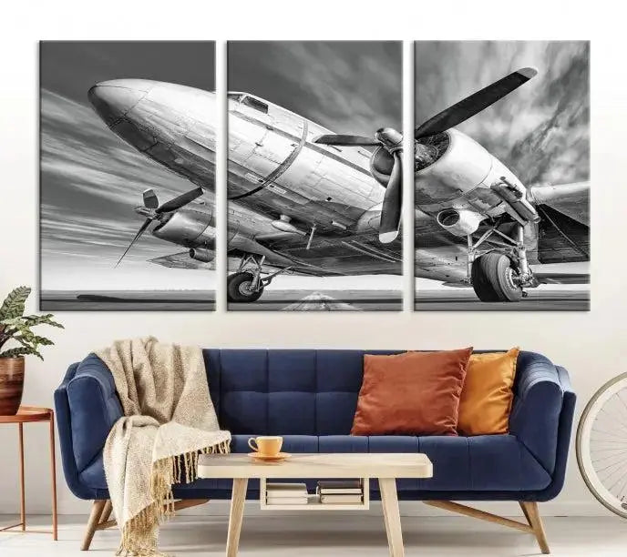 The Vintage Airplane on a Runway Canvas Print is elegantly showcased as a black and white triptych. Each panel is crafted on museum-quality canvases with a UV-protective coating for lasting beauty and durability. This timeless artwork comes with the convenience of free shipping.