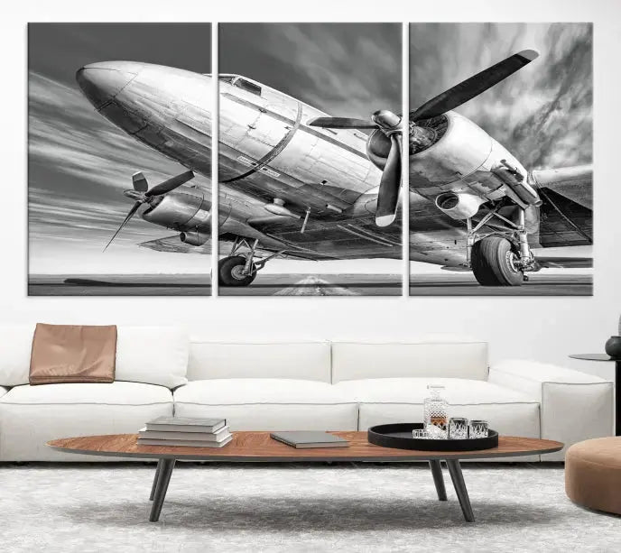 The Vintage Airplane on a Runway Canvas Print is elegantly showcased as a black and white triptych. Each panel is crafted on museum-quality canvases with a UV-protective coating for lasting beauty and durability. This timeless artwork comes with the convenience of free shipping.