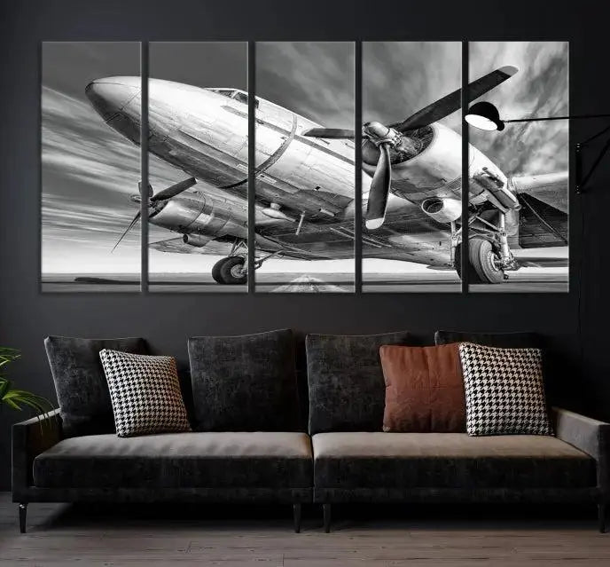 The Vintage Airplane on a Runway Canvas Print is elegantly showcased as a black and white triptych. Each panel is crafted on museum-quality canvases with a UV-protective coating for lasting beauty and durability. This timeless artwork comes with the convenience of free shipping.