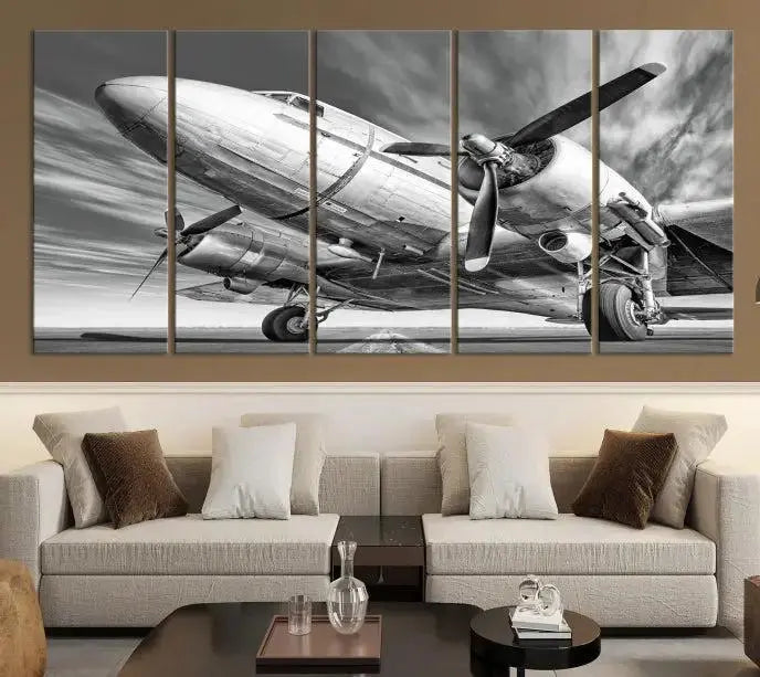 The Vintage Airplane on a Runway Canvas Print is elegantly showcased as a black and white triptych. Each panel is crafted on museum-quality canvases with a UV-protective coating for lasting beauty and durability. This timeless artwork comes with the convenience of free shipping.