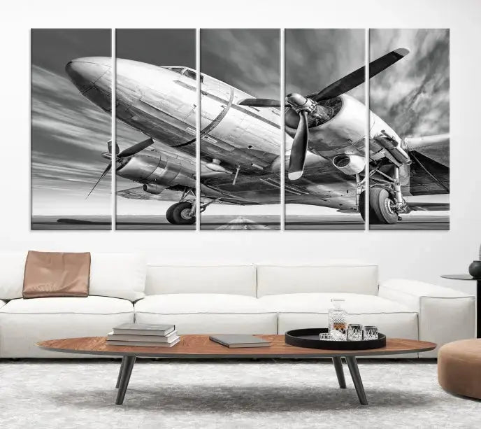 The Vintage Airplane on a Runway Canvas Print is elegantly showcased as a black and white triptych. Each panel is crafted on museum-quality canvases with a UV-protective coating for lasting beauty and durability. This timeless artwork comes with the convenience of free shipping.