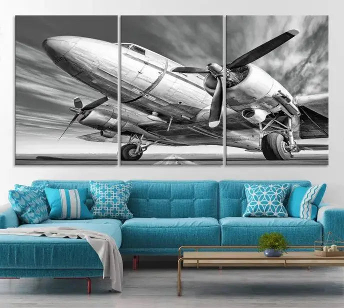 The Vintage Airplane on a Runway Canvas Print is elegantly showcased as a black and white triptych. Each panel is crafted on museum-quality canvases with a UV-protective coating for lasting beauty and durability. This timeless artwork comes with the convenience of free shipping.