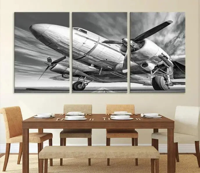 The Vintage Airplane on a Runway Canvas Print is elegantly showcased as a black and white triptych. Each panel is crafted on museum-quality canvases with a UV-protective coating for lasting beauty and durability. This timeless artwork comes with the convenience of free shipping.