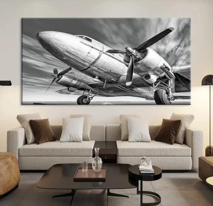 The Vintage Airplane on a Runway Canvas Print is elegantly showcased as a black and white triptych. Each panel is crafted on museum-quality canvases with a UV-protective coating for lasting beauty and durability. This timeless artwork comes with the convenience of free shipping.