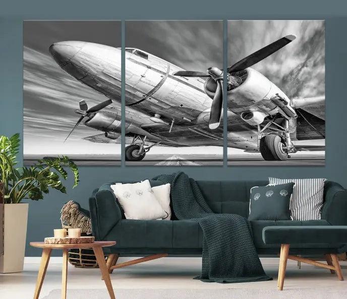 The Vintage Airplane on a Runway Canvas Print is elegantly showcased as a black and white triptych. Each panel is crafted on museum-quality canvases with a UV-protective coating for lasting beauty and durability. This timeless artwork comes with the convenience of free shipping.