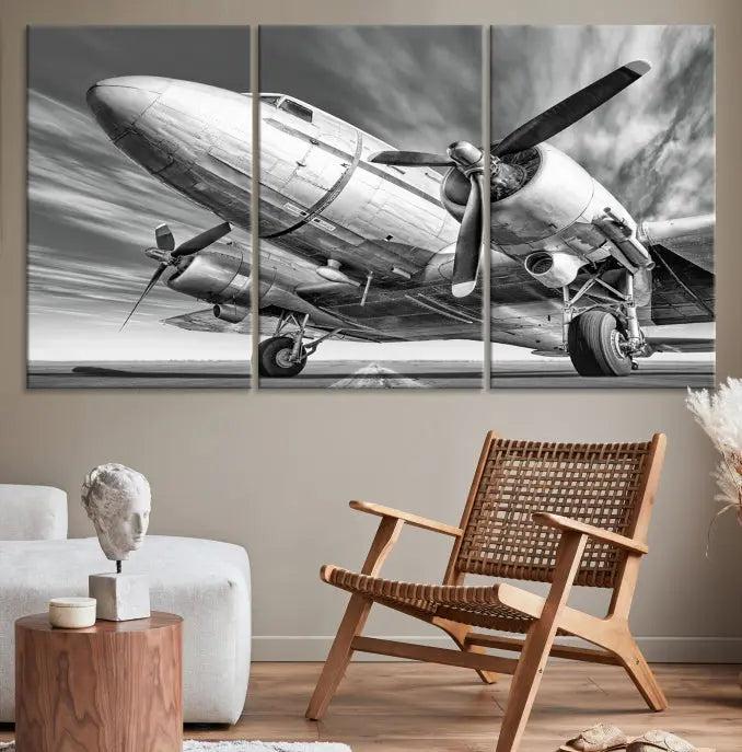 The Vintage Airplane on a Runway Canvas Print is elegantly showcased as a black and white triptych. Each panel is crafted on museum-quality canvases with a UV-protective coating for lasting beauty and durability. This timeless artwork comes with the convenience of free shipping.