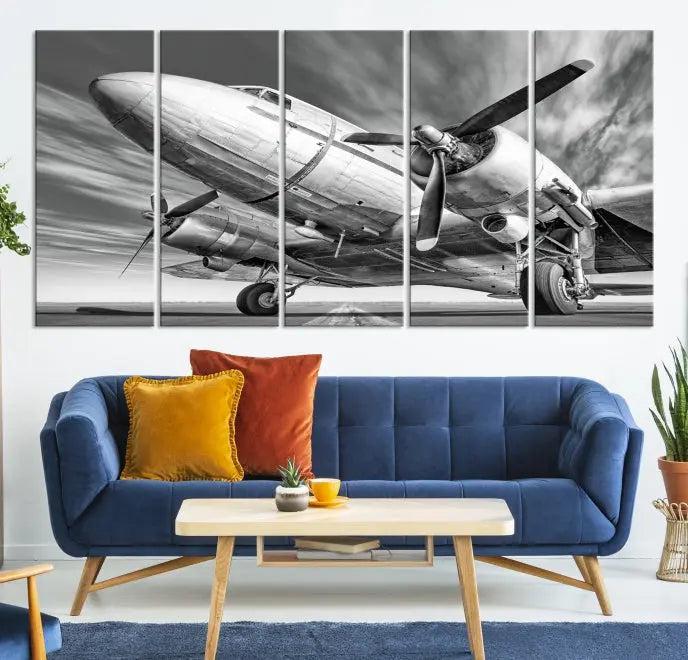 The Vintage Airplane on a Runway Canvas Print is elegantly showcased as a black and white triptych. Each panel is crafted on museum-quality canvases with a UV-protective coating for lasting beauty and durability. This timeless artwork comes with the convenience of free shipping.