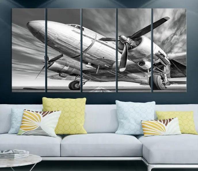 The Vintage Airplane on a Runway Canvas Print is elegantly showcased as a black and white triptych. Each panel is crafted on museum-quality canvases with a UV-protective coating for lasting beauty and durability. This timeless artwork comes with the convenience of free shipping.