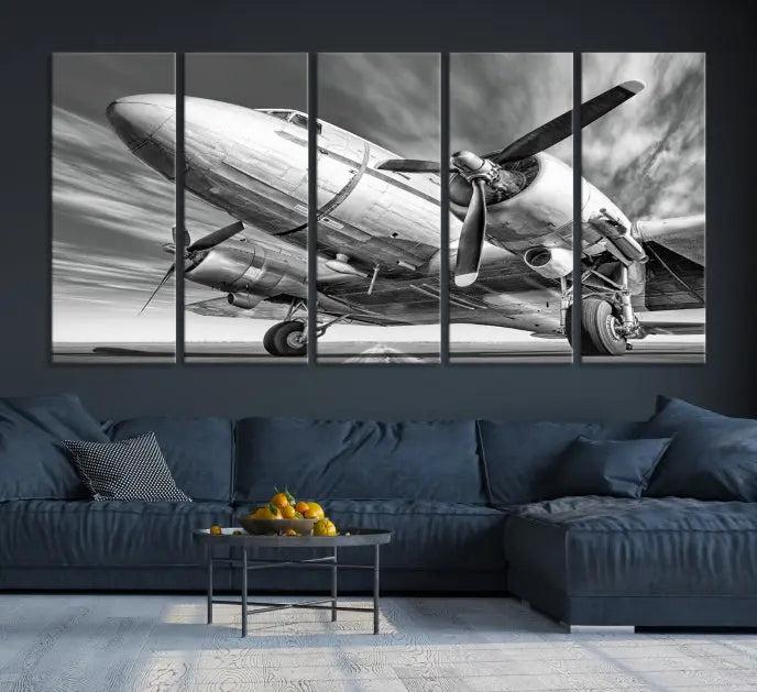 The Vintage Airplane on a Runway Canvas Print is elegantly showcased as a black and white triptych. Each panel is crafted on museum-quality canvases with a UV-protective coating for lasting beauty and durability. This timeless artwork comes with the convenience of free shipping.