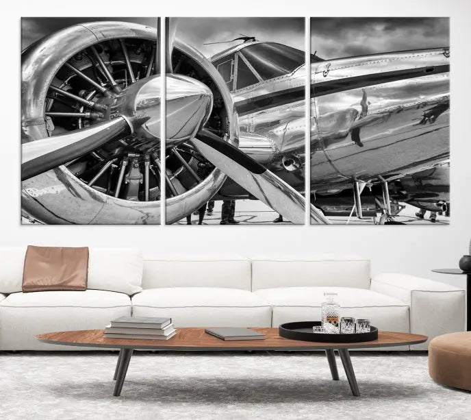 The Vintage Antique Airplane Wall Art Canvas Print, a black-and-white triptych of a propeller plane, exemplifies professional craftsmanship and adds an elegant touch to any space. This museum-quality canvas is an impressive display of artistic skill.