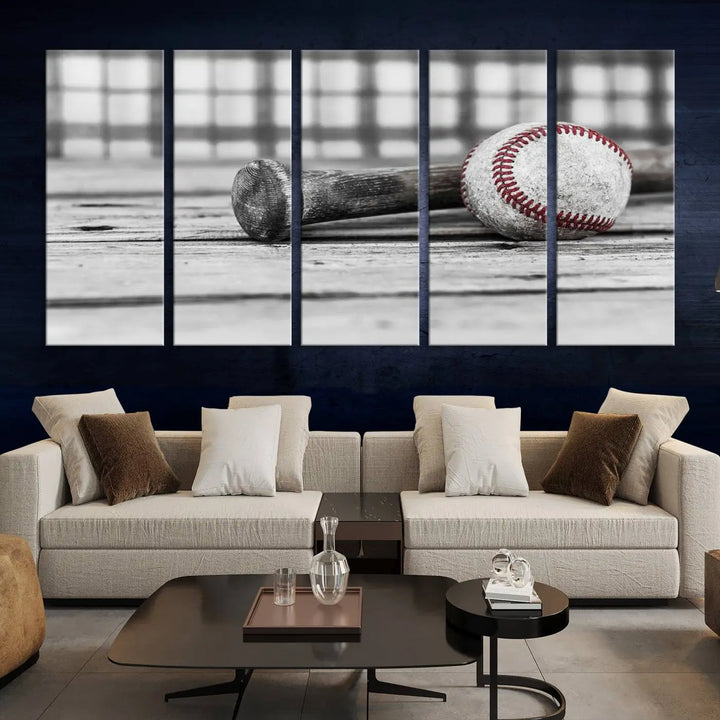 The Vintage Baseball Canvas Wall Art Print showcases a black and white photo of a baseball and bat on a wooden table, divided into three panels. Printed on museum-quality canvas with a UV-protective coating, this artwork arrives ready to hang, bringing timeless charm to any room.