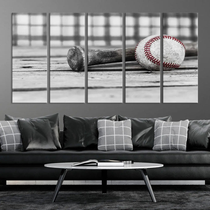 The Vintage Baseball Canvas Wall Art Print showcases a black and white photo of a baseball and bat on a wooden table, divided into three panels. Printed on museum-quality canvas with a UV-protective coating, this artwork arrives ready to hang, bringing timeless charm to any room.