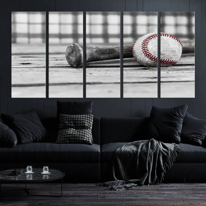 The Vintage Baseball Canvas Wall Art Print showcases a black and white photo of a baseball and bat on a wooden table, divided into three panels. Printed on museum-quality canvas with a UV-protective coating, this artwork arrives ready to hang, bringing timeless charm to any room.