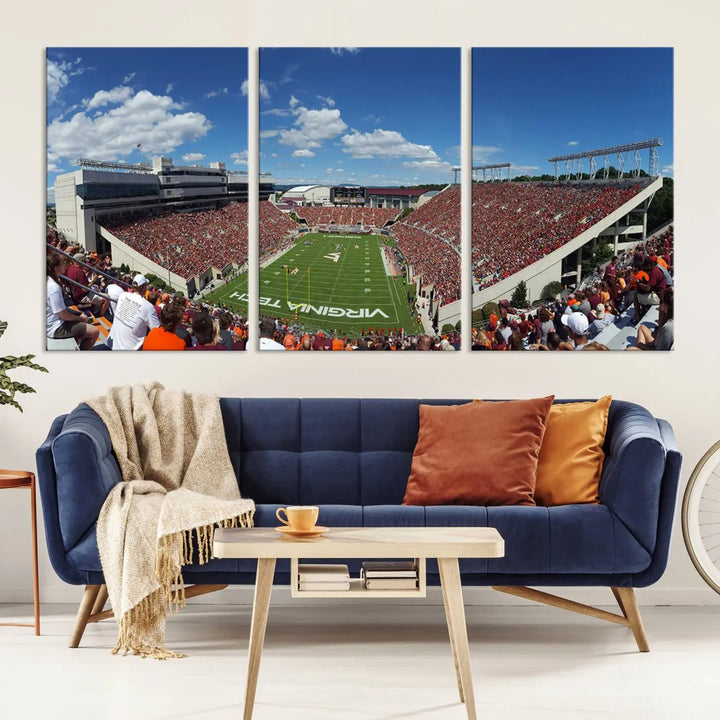 A gallery-quality triptych of the Virginia Tech Hokies Football Team, capturing the vibrant Blacksburg Lane Stadium, hangs in a well-lit, modern room. This handmade canvas artwork from the USA adds a dynamic touch to the space.