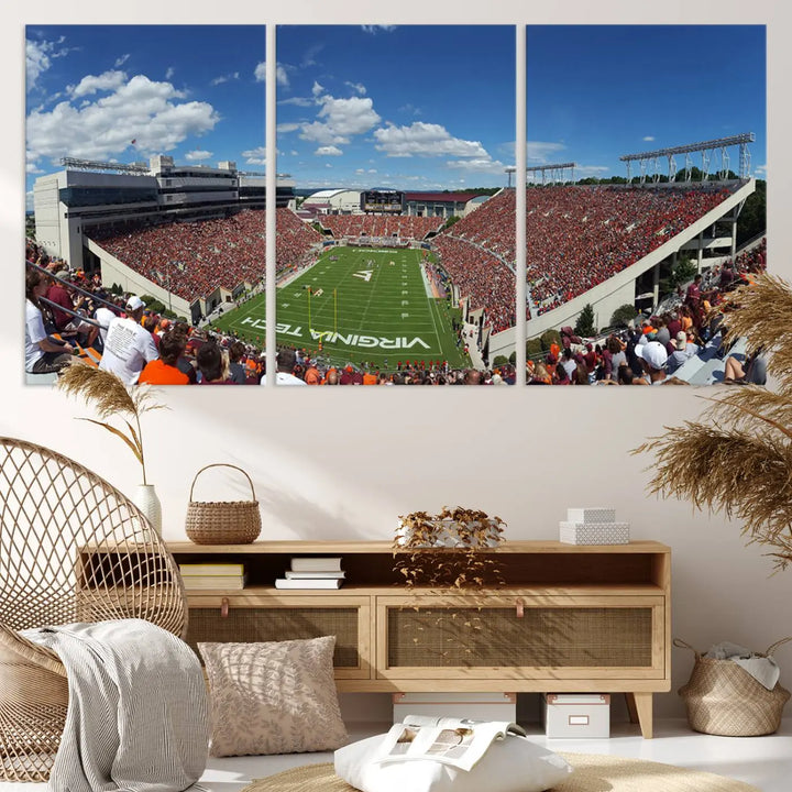 A gallery-quality triptych of the Virginia Tech Hokies Football Team, capturing the vibrant Blacksburg Lane Stadium, hangs in a well-lit, modern room. This handmade canvas artwork from the USA adds a dynamic touch to the space.