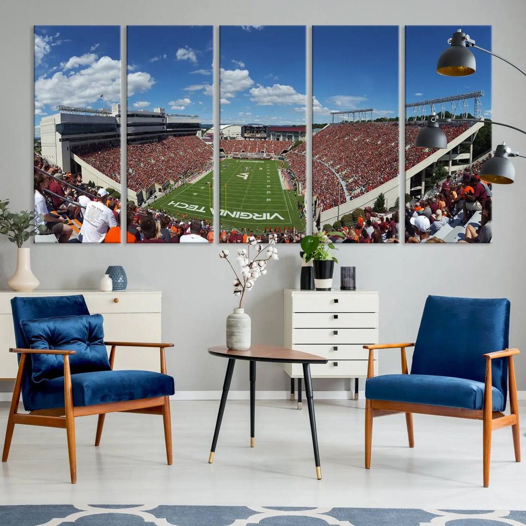 A gallery-quality triptych of the Virginia Tech Hokies Football Team, capturing the vibrant Blacksburg Lane Stadium, hangs in a well-lit, modern room. This handmade canvas artwork from the USA adds a dynamic touch to the space.