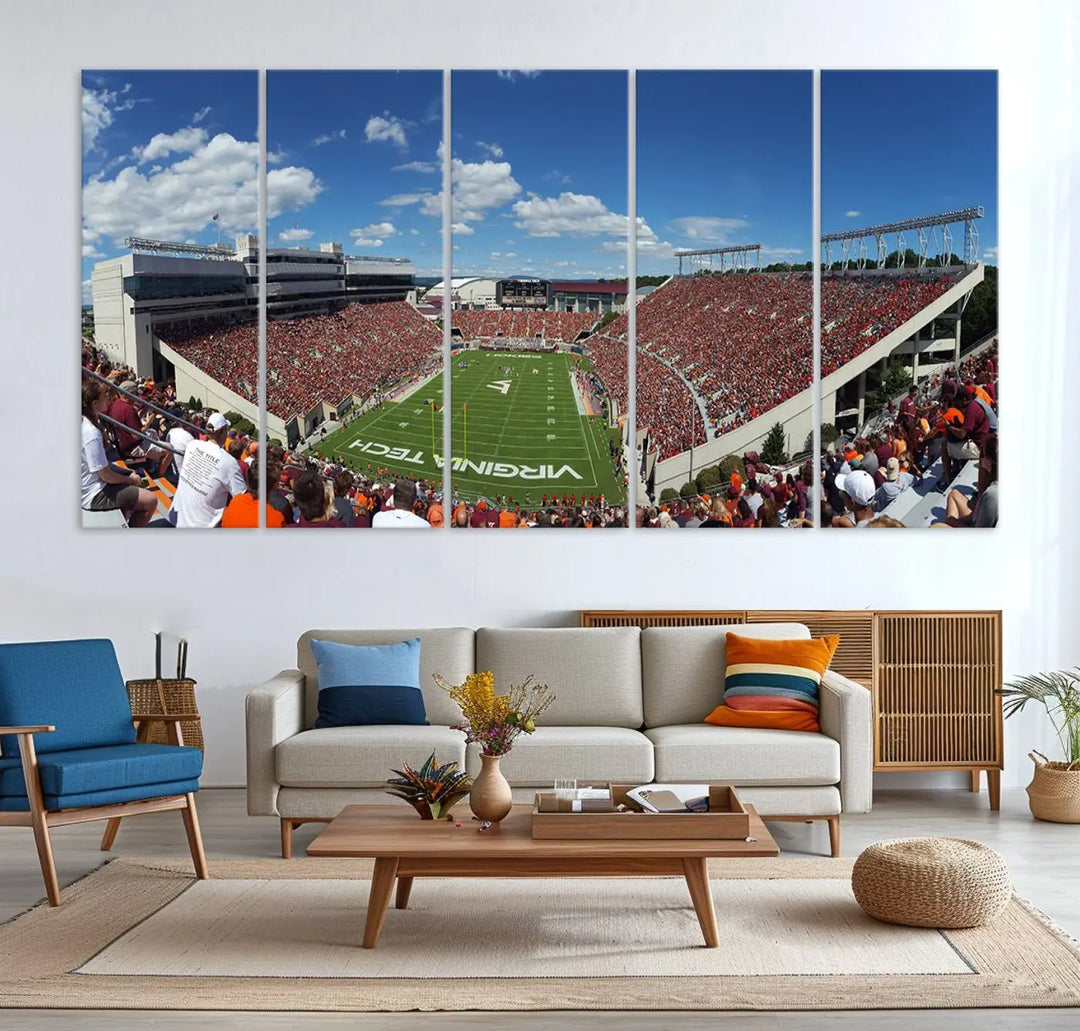 A gallery-quality triptych of the Virginia Tech Hokies Football Team, capturing the vibrant Blacksburg Lane Stadium, hangs in a well-lit, modern room. This handmade canvas artwork from the USA adds a dynamic touch to the space.