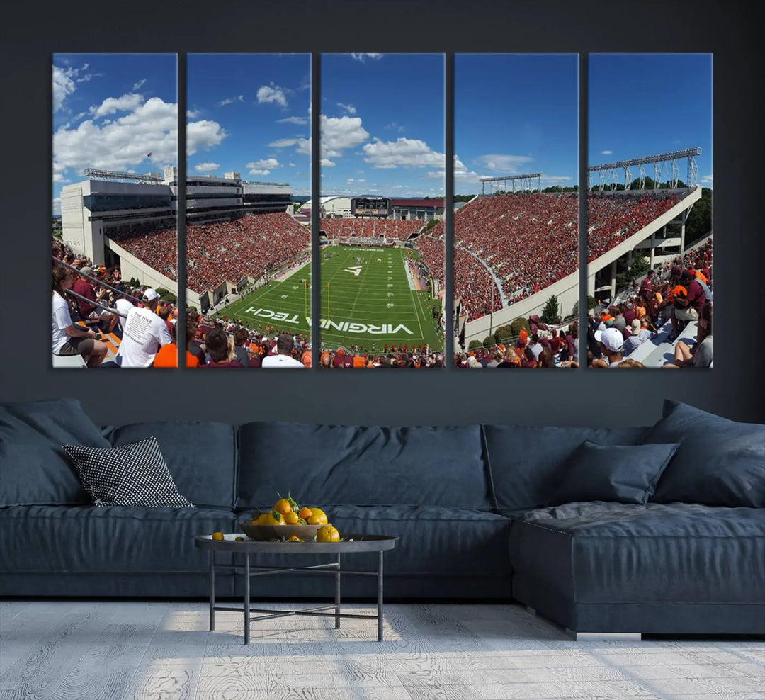 A gallery-quality triptych of the Virginia Tech Hokies Football Team, capturing the vibrant Blacksburg Lane Stadium, hangs in a well-lit, modern room. This handmade canvas artwork from the USA adds a dynamic touch to the space.