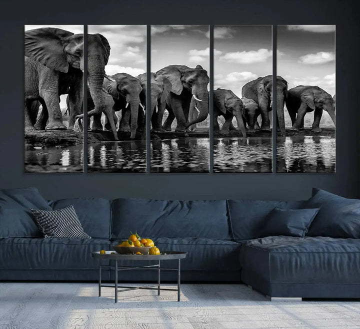 A stunning "Wall Art Animal Canvas Print" featuring a black and white photo of a herd of elephants drinking water is elegantly displayed, gallery wrapped on museum-quality canvas.