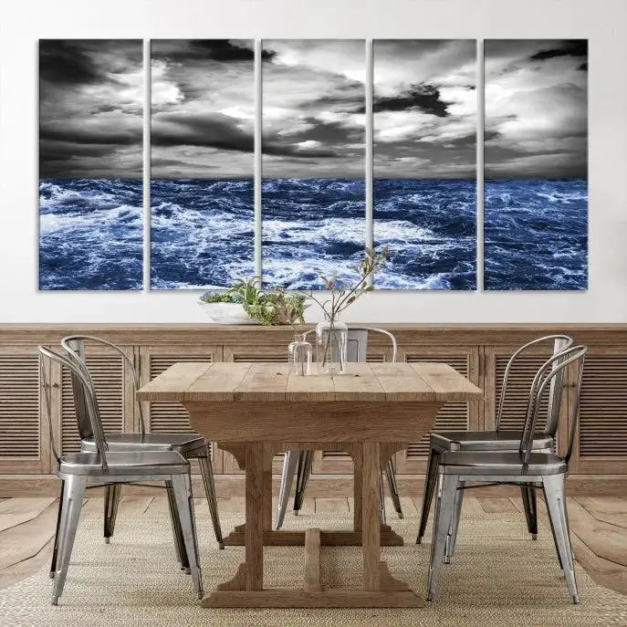 The dining area showcases the "Wall Art Canvas 5 Panels Storm in Ocean," crafted on museum-quality polycotton canvas. It features a UV-protective coating and is ready to hang.