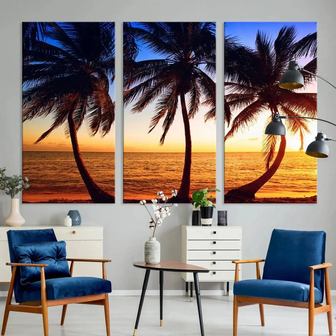 The living room features a wall adorned with the "Wall Art Canvas Curve Palms at Sunset on Beach," showcasing gallery-wrapped, museum-quality canvases in a stunning triptych.