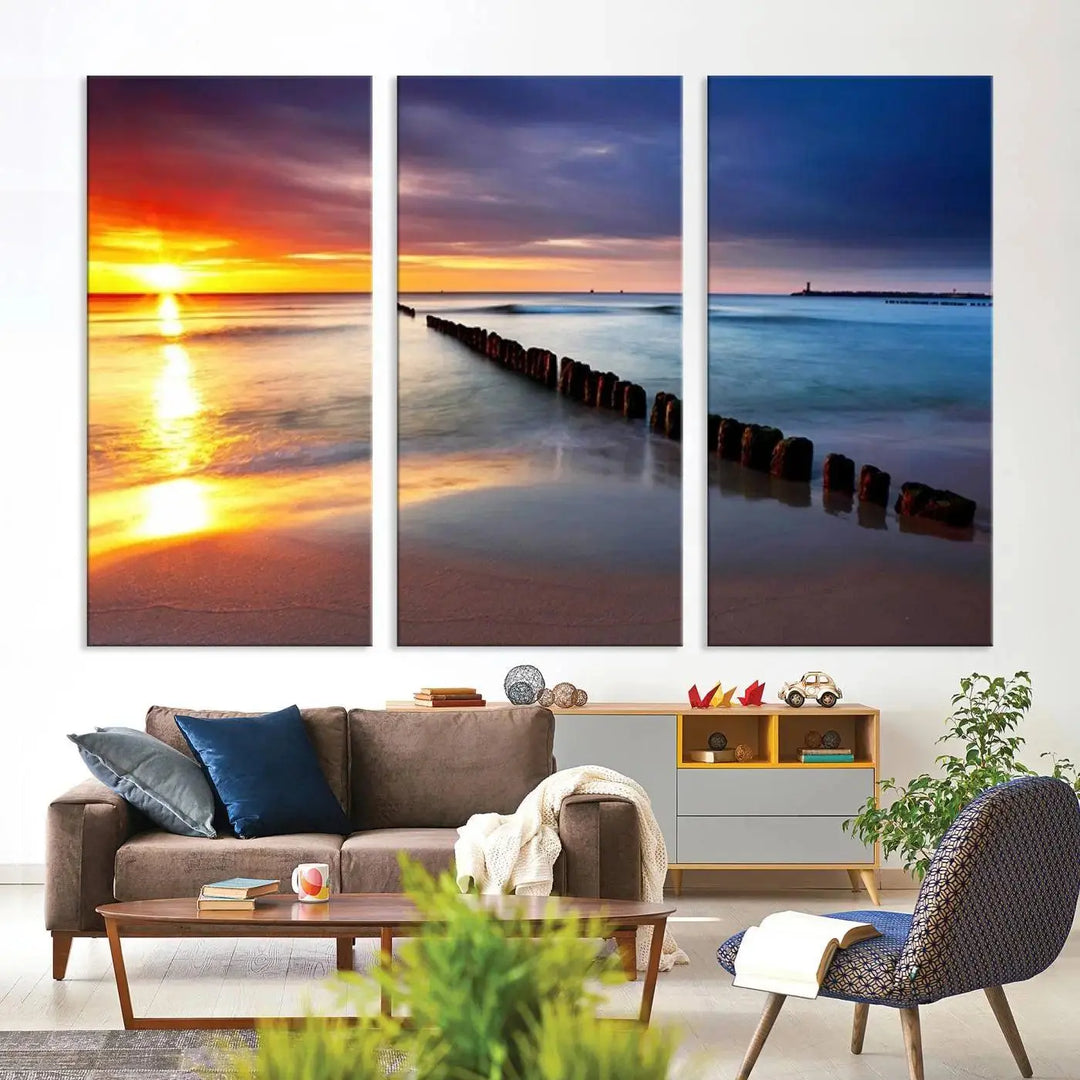 In the living room, a Wall Art Canvas Print features a colorful sunset over the ocean beach. This triptych wall art is crafted on museum-quality canvas, with each piece meticulously hand-assembled to guarantee exceptional quality and aesthetic allure. Plus, enjoy free shipping when you bring this masterpiece home.